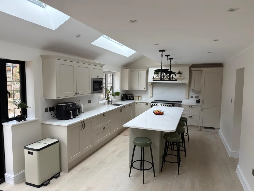 Cream shaker kitchen with quartz worktops, an island and roof lights